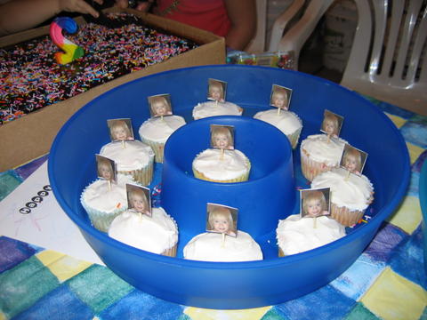 Cupcakes - These are the cupcakes I made for my niece's second birthday.  They have pics with little pics of her on one side and a 2 with some party hats on the other side.