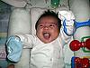 smile - my son russell with a toy he received on his baptism