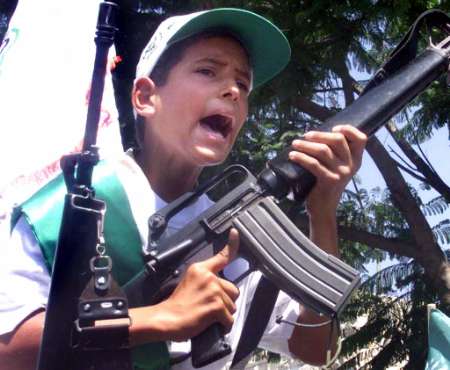 kid with gun - An arabian kid holding a weapon