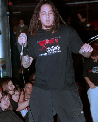 P.O.D. - While they play around with the infectious grooves of reggae and Latin music as well as the heavy deliverance of hip-hop and rock, San Diego's hard rock four-piece P.O.D. has defined a universal message. They're born-again Christians and their faith takes a central place in their music.Formed in 1992 in the SoCal neighborhood of San Ysidro, Marcos (guitar) and Wuv (drums) relished the music they grew up on. San Ysidro or 'Southtown' was a multicultural area, but working class. While Marcos and Wuv were fond of their jazz and reggae roots, they were young punks in the making. Both loved the gnarl of grunge and took to liking Green Day, Pennywise, Bad Brains, and the Vandals. They got a band together, P.O.D. (short for 'Payable on Death'), with Wuv's hip-hop MC cousin, Sonny, and aimed for something real. Cleveland native Traa joined in 1993 and P.O.D. were on the map.Throughout the 1990s, P.O.D. played countless shows across the nation and sold more than 40,000 copies of their three homemade EPs -- Brown, Snuff the Punk, and P.O.D. Live -- on their own Rescue Records. Atlantic Records was intrigued by the group's hard-working ethic and passion for music, inking a deal with P.O.D. in 1998. The Warriors EP preceded the major-label debut of P.O.D.'s 1999 release, The Fundamental Elements of Southtown. 'Southtown' and 'Rock the Party (Off the Hook)' were powerful singles, pushing the album to go platinum. P.O.D. earned top honors for Best Hard Rock or Metal Group, Album of the Year, and Song of the Year for 'Rock the Party (Off the Hook)' at the 1999 San Diego Music Awards as well.A year later and with the buzz still going, P.O.D. hit the road with Ozzfest 2000 and shared dates with Crazy Town and Staind for the MTV Campus Invasion tour. They also ventured into films, contributing several songs to various soundtracks. 'School of Hard Knocks' proved successful in the Adam Sandler comedy Little Nicky in 2001, whereas additional tracks featured in the Al Pacino sports thriller Any Given Sunday and Ready to Rumble maintained P.O.D.'s growing status. A second album for Atlantic, Satellite, was recorded with Howard Benson in spring 2001. Benson captured the magic once again, for P.O.D.'s stature exploded later that year, hot on the heels of the spiritual chaos of debut single 'Alive.' 'Youth of the Nation' scored again for P.O.D., as its positive mix of hip-hop, reggae, and hardcore punk defined a different kind of rock next to the likes of Kid Rock, Limp Bizkit, and Korn.