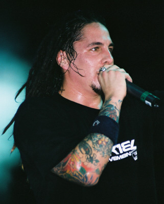 P.O.D. - While they play around with the infectious grooves of reggae and Latin music as well as the heavy deliverance of hip-hop and rock, San Diego's hard rock four-piece P.O.D. has defined a universal message. They're born-again Christians and their faith takes a central place in their music.Formed in 1992 in the SoCal neighborhood of San Ysidro, Marcos (guitar) and Wuv (drums) relished the music they grew up on. San Ysidro or 'Southtown' was a multicultural area, but working class. While Marcos and Wuv were fond of their jazz and reggae roots, they were young punks in the making. Both loved the gnarl of grunge and took to liking Green Day, Pennywise, Bad Brains, and the Vandals. They got a band together, P.O.D. (short for 'Payable on Death'), with Wuv's hip-hop MC cousin, Sonny, and aimed for something real. Cleveland native Traa joined in 1993 and P.O.D. were on the map.Throughout the 1990s, P.O.D. played countless shows across the nation and sold more than 40,000 copies of their three homemade EPs -- Brown, Snuff the Punk, and P.O.D. Live -- on their own Rescue Records. Atlantic Records was intrigued by the group's hard-working ethic and passion for music, inking a deal with P.O.D. in 1998. The Warriors EP preceded the major-label debut of P.O.D.'s 1999 release, The Fundamental Elements of Southtown. 'Southtown' and 'Rock the Party (Off the Hook)' were powerful singles, pushing the album to go platinum. P.O.D. earned top honors for Best Hard Rock or Metal Group, Album of the Year, and Song of the Year for 'Rock the Party (Off the Hook)' at the 1999 San Diego Music Awards as well.A year later and with the buzz still going, P.O.D. hit the road with Ozzfest 2000 and shared dates with Crazy Town and Staind for the MTV Campus Invasion tour. They also ventured into films, contributing several songs to various soundtracks. 'School of Hard Knocks' proved successful in the Adam Sandler comedy Little Nicky in 2001, whereas additional tracks featured in the Al Pacino sports thriller Any Given Sunday and Ready to Rumble maintained P.O.D.'s growing status. A second album for Atlantic, Satellite, was recorded with Howard Benson in spring 2001. Benson captured the magic once again, for P.O.D.'s stature exploded later that year, hot on the heels of the spiritual chaos of debut single 'Alive.' 'Youth of the Nation' scored again for P.O.D., as its positive mix of hip-hop, reggae, and hardcore punk defined a different kind of rock next to the likes of Kid Rock, Limp Bizkit, and Korn.