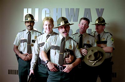 Super Troopers - Thorny, Rabbit, Mac and Foster are passable Vermont State Troopers. Stationed in the boonies on the Canadian border, they spend the bulk of their time playfully toying with speeders and taking impounded sports cars for spins on the open highway. When they're not on the road, they try to stay on the good side of their fatherly mentor, Captain O'Hagan, and avoid their tactless, thick-necked compatriot, Officer Rod Farva. All in all, they find their work to be pleasantly unchallenging. However, once the state targets their low volume station for a potential budget slash, the guys decide to buckle down to impress the higher ups. Things look bleak until, unexpectedly, the State Troopers' new 'by the book' attitude uncovers a drug smuggling operation running across the border to Canada. Sensing salvation, the Troopers race the clock to crack the ring and save their jobs. But they aren't the only ones in the hunt.