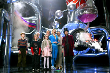 Charlie and the Chocolate Factory  - Most nights in the Bucket home, dinner is a watered-down bowl of cabbage soup, which young Charlie gladly shares with his mother and father and both pairs of grandparents. Every night, the last thing Charlie sees from his window is Willy Wonka's great factory, and he drifts off to sleep dreaming about what might be inside. For nearly fifteen years, no one has seen a single worker going in or coming out of the factory, or caught a glimpse of Wonka himself, yet, great quantities of chocolate are still being made and shipped all over the world. One day Willy Wonka makes a momentous announcement. He will open his famous factory and reveal 'all of its secrets and magic' to five lucky children who find golden tickets hidden inside five randomly selected Wonka chocolate bars. Nothing would make Charlie's family happier than to see him win but the odds are very much against him as they can only afford to buy one chocolate bar a year, for his birthday. One by one, news breaks around the world about the children finding golden tickets and Charlie's hope grows dimmer. But then, something wonderful happens. Charlie finds some money on the snowy street and takes it to the nearest store for a Wonka Whipple-Scrumptious Fudgemallow Delight. There, under the wrapper is a flash of gold. It's the last ticket. Charlie is going to the factory! The family decides that Grandpa Joe, who used to work in the factory, should be the one to accompany Charlie on this adventure. Once inside, Charlie is dazzled by one amazing sight after another. Wondrous gleaming contraptions of Wonka's own invention churn, pop, and whistle, crews of merry Oompa-Loompas mine mountains of fudge beside a frothy chocolate waterfall, a hundred trained squirrels on a hundred tiny stools shell nuts for chocolate bars, and Wonka himself pilots an impossible glass elevator that rockets every which way you can think of through the fantastic factory. Almost as intriguing as his fanciful inventions is Willy Wonka. He thinks about nothing but candy--except, every once in a while, when he seems to be thinking about something that happened long ago, that he can't quite talk about. Meanwhile, the other children prove to be a rotten bunch, and one by one, their greedy personalities lead them into all kinds of trouble that force them off the tour. When only Charlie is left, Willie Wonka reveals the final secret, the absolute grandest prize of all: the keys to the factory itself.