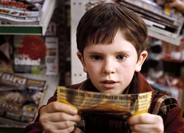 Charlie and the Chocolate Factory  - Most nights in the Bucket home, dinner is a watered-down bowl of cabbage soup, which young Charlie gladly shares with his mother and father and both pairs of grandparents. Every night, the last thing Charlie sees from his window is Willy Wonka's great factory, and he drifts off to sleep dreaming about what might be inside. For nearly fifteen years, no one has seen a single worker going in or coming out of the factory, or caught a glimpse of Wonka himself, yet, great quantities of chocolate are still being made and shipped all over the world. One day Willy Wonka makes a momentous announcement. He will open his famous factory and reveal 'all of its secrets and magic' to five lucky children who find golden tickets hidden inside five randomly selected Wonka chocolate bars. Nothing would make Charlie's family happier than to see him win but the odds are very much against him as they can only afford to buy one chocolate bar a year, for his birthday. One by one, news breaks around the world about the children finding golden tickets and Charlie's hope grows dimmer. But then, something wonderful happens. Charlie finds some money on the snowy street and takes it to the nearest store for a Wonka Whipple-Scrumptious Fudgemallow Delight. There, under the wrapper is a flash of gold. It's the last ticket. Charlie is going to the factory! The family decides that Grandpa Joe, who used to work in the factory, should be the one to accompany Charlie on this adventure. Once inside, Charlie is dazzled by one amazing sight after another. Wondrous gleaming contraptions of Wonka's own invention churn, pop, and whistle, crews of merry Oompa-Loompas mine mountains of fudge beside a frothy chocolate waterfall, a hundred trained squirrels on a hundred tiny stools shell nuts for chocolate bars, and Wonka himself pilots an impossible glass elevator that rockets every which way you can think of through the fantastic factory. Almost as intriguing as his fanciful inventions is Willy Wonka. He thinks about nothing but candy--except, every once in a while, when he seems to be thinking about something that happened long ago, that he can't quite talk about. Meanwhile, the other children prove to be a rotten bunch, and one by one, their greedy personalities lead them into all kinds of trouble that force them off the tour. When only Charlie is left, Willie Wonka reveals the final secret, the absolute grandest prize of all: the keys to the factory itself.