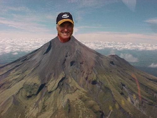 On top of the World. - Just a fun photo sticking one on top of the other. The mountain is Mount Taranaki in New Zealand, 8,000 feet high.