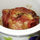 slow cook crock pot ham - INGREDIENTS 2 cups packed brown sugar  1 (8 pound) cured, bone-in picnic ham  DIRECTIONS Spread about 1 1/2 cups of brown sugar on the bottom of the slow cooker crock. Place the ham flat side down into the slow cooker - you might have to trim it a little to make it fit. Use your hands to rub the remaining brown sugar onto the ham. Cover, and cook on Low for 8 hours.