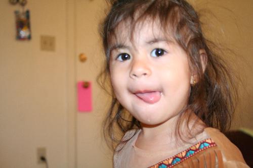Lydia being a Goofball - Lydia is wearing her Pocahontas costume and sticking her tongue out.  She's being silly!