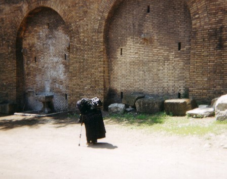 Roman Wall - I photographed an old beggar at the wall of the Roman Forum in Rome.