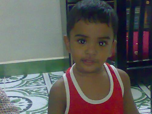 Child`s smile - hi guys this is a childs which i took in my home,,,,see the real enthu in his eyes of seeing this world and me.......