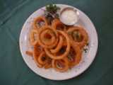 Onion Rings - Onion rings are rings of onion cut up, dipped into batter and deeped fried. Great finger food at the bar or club.