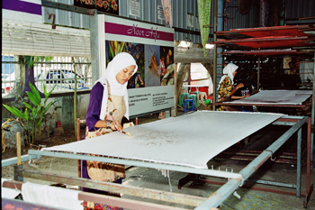 Mencanting - first step of making batik