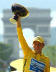 Lance Armstrong - photo of Lance Armstrong holding high the winner's cup after finishing 1st in a Tour de France.