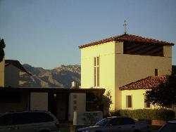 An Autumn Evening in Tucson - Sun setting on Catalina Methodist Church in Tucson, AZ with Catalina Mountains in background.