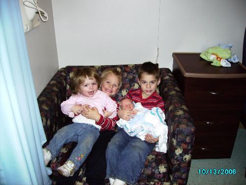 My reason to quite smoking - Here is my children from oldest to younget.
Steve(oldest),Matt(2nd oldest),Sammie(3rd oldest),Scott(baby) sitting in a chair together. Matt is holding on Sammie and Steve is holding on Scott.