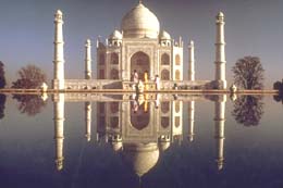 Taj Mahal - Agra, once the capital of the Mughal Empire during the 16th and early 18th centuries, is one and a half hours by express train from New Delhi. Tourists from all over the world visit Agra not to see the ruins of the red sandstone fortress built by the Mughal emperors but to make a pilgrimage to Taj Mahal, India’s most famous architectural wonder, in a land where magnificent temples and edificies abound to remind visitors about the rich civilization of a country that is slowly but surely lifting itself into an industrialized society.