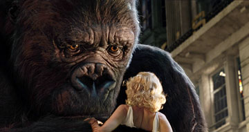 king kong - Ann (Naomi Watts) is caught between a Tyrannosaurus Rex and Kong (performed by Andy Serkis)