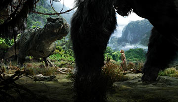 king kong - Kong faces a Tyrannosaurus Rex, with Ann Darrow (Naomi Watts) caught between in Universal