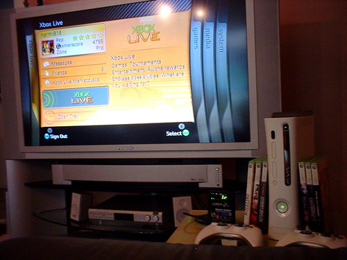 My xbox 360 setup - The living room in which i play my xbox 360. Big tv, nice couch, many games, all cool.