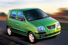 santro car - a green santro car