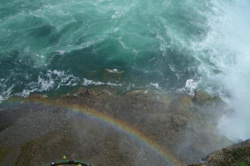 Rainbow In The Niagara Falls - Looking down into the basin of Niagara Falls (from the Canadian side)  All of a sudden this caught my eye, I saw a rainbow formed in the mist that arose from the Falls.