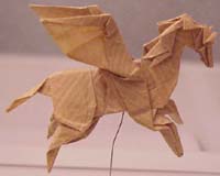 Paper Horse - The practice and study of origami encapsulates several subjects of mathematical interest. Using optimization algorithms, a circle-packing figure can be computed for any uniaxial base of arbitrary complexity.