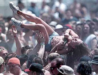 Livestock Crowd Surfing - A crowd surfer makes her way.