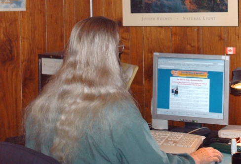 Old man with long hair, why? - This is a photo of my at my computer in my office. Three years ago I had very short hair, almost a brush cut and then Feb. 2004 on Friday the 13th I had my first heart attack.  I went a few months without a haircut because I just didn't have the strength or desire to get it cut. Then one day I was on my daily walk and stopped in at a barber shop but he was busy so I said I would come back later. Well that was almost three years ago.  On the rest of my walk that day I was daydreaming about fishing. A hobby I was no longer able to do so as I continued my walk I decided I would not get a hair cut until I caught my next fish.