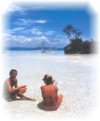 Boracay - Boracay is centrally located in the Visayas island group, lying near the northern tip of Panay Island. Tourists can go diving, snorkeling, kayaking, canoeing and windsurfing. Boracay is a walker’s paradise. The center of the island, which contains most of the important tourist locations, is quite flat, while the hilly northern part and southern ends are a magnet of the very active. Susligan and Bat caves, which contain colonies of flying foxes (fruit bats) are a major attraction to hikers. The most popular means of traveling to Boracay is by air. There are regular flights from Manila to Kalibo Airport on Panay Island. The flight take less than one hour but an additional 90 minute bus trio to the Caticlan Jetty Port is required. Smaller turbo prop planes fly directly to Caticlan Airport, only a short tricycle ride from the jetty. Boracay itself is reached by the traveling on  bancas (small boats), which continuously ply the short strait between the island and mainland Panay.