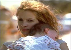 Erin Brockovich - Erin Brockovich is an unemployed single mother, desperate to find a job, but is having no luck. This losing streak even extends to a failed lawsuit against a doctor in a car accident she was in. With no alternative, she successfully browbeats her lawyer to give her a job in compensation for the loss. While no one takes her seriously, with her trashy clothes and earthy manners, that soon changes when she begins to investigate a suspicious real estate case involving the Pacific Gas & Electric Company. What she discovers is that the company is trying quietly to buy land that was contaminated by hexavalent chromium, a deadly toxic waste that the company is improperly and illegally dumping and, in turn, poisoning the residents in the area. As she digs deeper, Erin finds herself leading point in a series of events that would involve her lawfirm in one of the biggest class action lawsuits in American history against a multi-billion dollar corporation.  Source: http://www.imdb.com/title/tt0195685/plotsummary