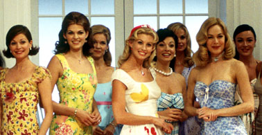 The Stepford Wives - Joanna Eberhart (Nicole Kidman) is a successful TV producer on the verge of yet another Emmy-winning streak of TV shows when she is fired from her job at a prestigious network. She then has a mental breakdown and her husband Walter (Matthew Broderick) and their two children (Dylan Hartigan, Fallon Brooking) move to Stepford, Conneticut, the most perfectly perfect little town there ever was. The women of Stepfrod spend all day knitting, gardening, exercising in beautiful dresses, and are the most splendid of all women on Earth. Soon, Joanna along with her best-selling author buddy, Bobbie (Bette Midler) and Democratic, flamboyant fairy friend Roger (Roger Bart) realize that something isn't right in Stepford. All is not as perfect as it seems...especially after Roger and Bobbie are turned into perfect portraits of Stepford. Why are the women of Stepfrod so perfect? What do the Stepford Husabnds have to do with the scheme? Will Joanna ultimately uncover the truth? Or are the Stepford coming for her to make her a blonde, bubbly piece of perfection?  Source: http://www.imdb.com/title/tt0327162/plotsummary