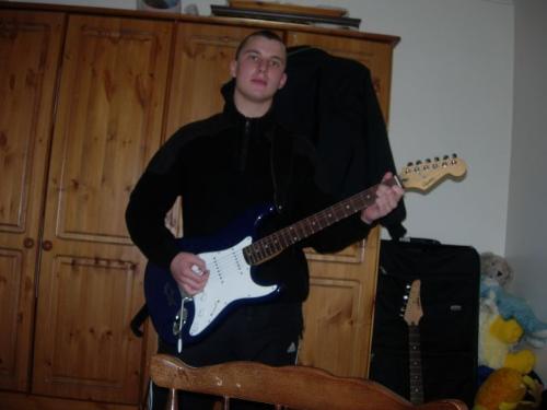 guitar - this is me a while ago with my guitar. my hair is longer now.