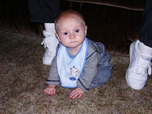 This is my Ashton. - This is a photo of my 5 month old son, Ashton.  This picture was taken at my grandmother's apartment the weekend of Christmas.  My mom was working on trying to get him to sit on his own.  He did pretty good!