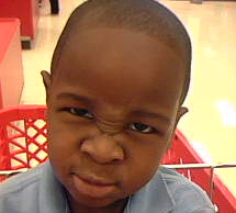 I pity the Fool - This is my only son making a mean face in a grocery basket.  Everytime I pull out the camera or camera phone he can never just smile.  Although, he did not smile on this picture I still think its cute.  He is 3 years old.  I think he looks like Mr. T.