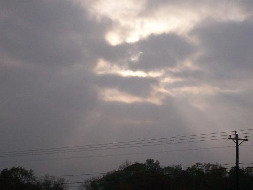 Sunshine on a cloudy day - Sun rays breaking through the clouds on a fall day in North East Georgia