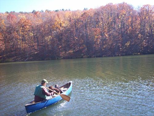 Man and his best friends in Canoe - NE Georgia- Man with his 2 dogs on a cool fall day canoeing with his dogs.