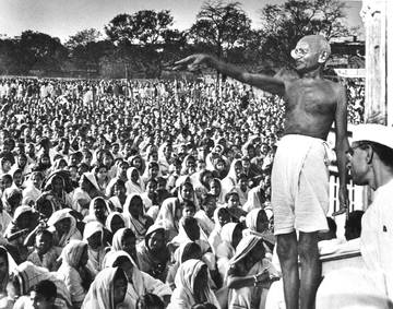 Mahatma Addressing Nation. - Mahatma Gandhi is addressing a conference.