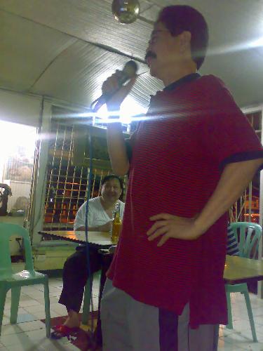 my dad singing - my dad singing in a friend's karaoke bar.