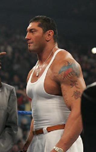 Batista with Philippine flag tattoo - shown in this photo is the philippine flag tattoo of batista. he is half-filipino and he is proud to be one. that's why the filipino fans just love him to death! mabuhay si batista!