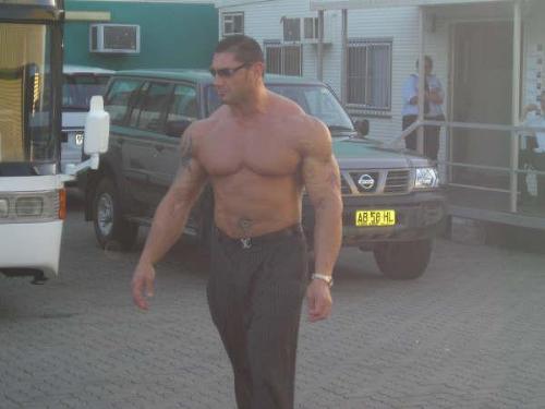 batista - batista is seen walking outside his trailer before a wwe schedule. he is the greatest wrestler there is now!
