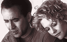 Meg Ryan and Nicolas Cage in City of Angels - Angels are among us and when we feel an invisible presence, you better believe they are watching you. For a Los Angeles heart surgeon named Maggie, that is too much of a stretch. She believes that it is her job to save the lifes of her patients and when she meets Seth after visiting hours are over, he tells her it's simply just their time to go. She becomes intrigued by his presence and opinion. Seth is not just normal, he is an Angel. He meets Messinger while visiting patients. Messinger can see him because he was once a Angel but gave his power up to become human. This makes Seth want to become human so he can feel, smell, and love Maggie.  http://www.imdb.com/title/tt0120632/plotsummary