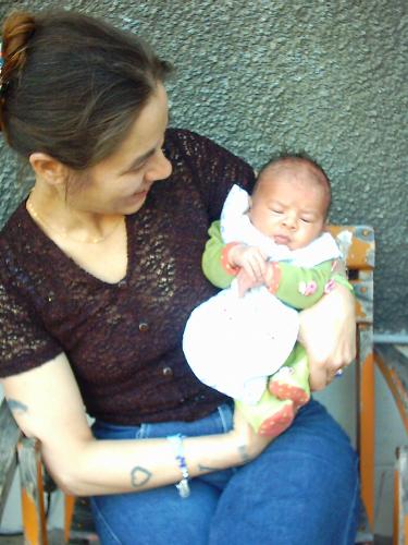 here i'm with my daughter's son - Here is the son of my daughter and me, he is 6 month old and he've got two teeth.He's a great baby and i love him so much.Well he's been came in july it was hard because the weather was so hot but now it's so colder for him.He catch his toys and try to sit down but he can't.He laugh very well.My daughter and me have a great chance to have him, it's a very beautiful boy.Ahissata