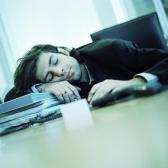 Guy sleeping at his desk - This guy is obviously sleep deprived or just really bored. I know that during the day I am really bored and tired. I wish that I could sleep at the desk and get away with it!