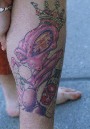 Tattooz - 7.5 hours...over 40 shades of purple to pink  The alien is holding onto 'the planet Earth' like a pillow, which has a band-aid on a bleeding wound on the inside(left) area.  There are two reflections of the appocolypse in his eyes and he is surrounded by negetive influences at his feet:gun,drugs,booze etc.  the idea is....Why are you humans doing this to your planet?