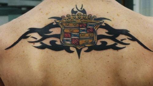 Cadillac Symbol - 6.5 hours.  hard to see in the pic but there is a 'nugget' effect in the gold and each red square of the inner details are done with a 'marble look'