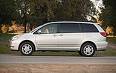 Toyota sienna - this is an image of a white toyota sienna mini van