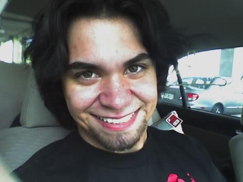 Just me - Just a picture of me being bored in a car. I know I know, what a lovely smile. :) I shaved my gotee off and I want it back. I would prefer a job more however.