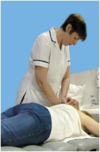 Physiotherapy - A Physical therapist massaging a patient. Physiotherapy - A Physical therapist massaging a patient.