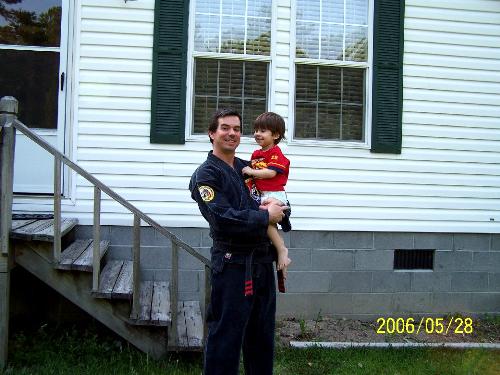the love of my life - my honey and little josh outside our home