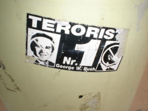 #1 Terrorist, George Bush - In Europe this summer, this was a sticker that was outside of a building in Latvia. The sticker reads, #1 Terrorist, George Bush,