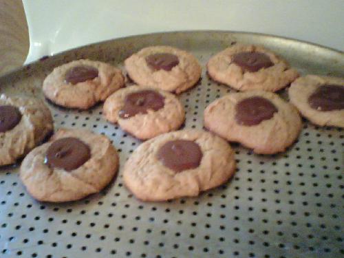 'Hershey Squirt' Cookies - My first attempts at making Peanut Blossom Cookies. I put the chocolate on too soon and they melted, leaving nothing but the pointy tops.. So I now call it.. Hershey Squirt Cookies!